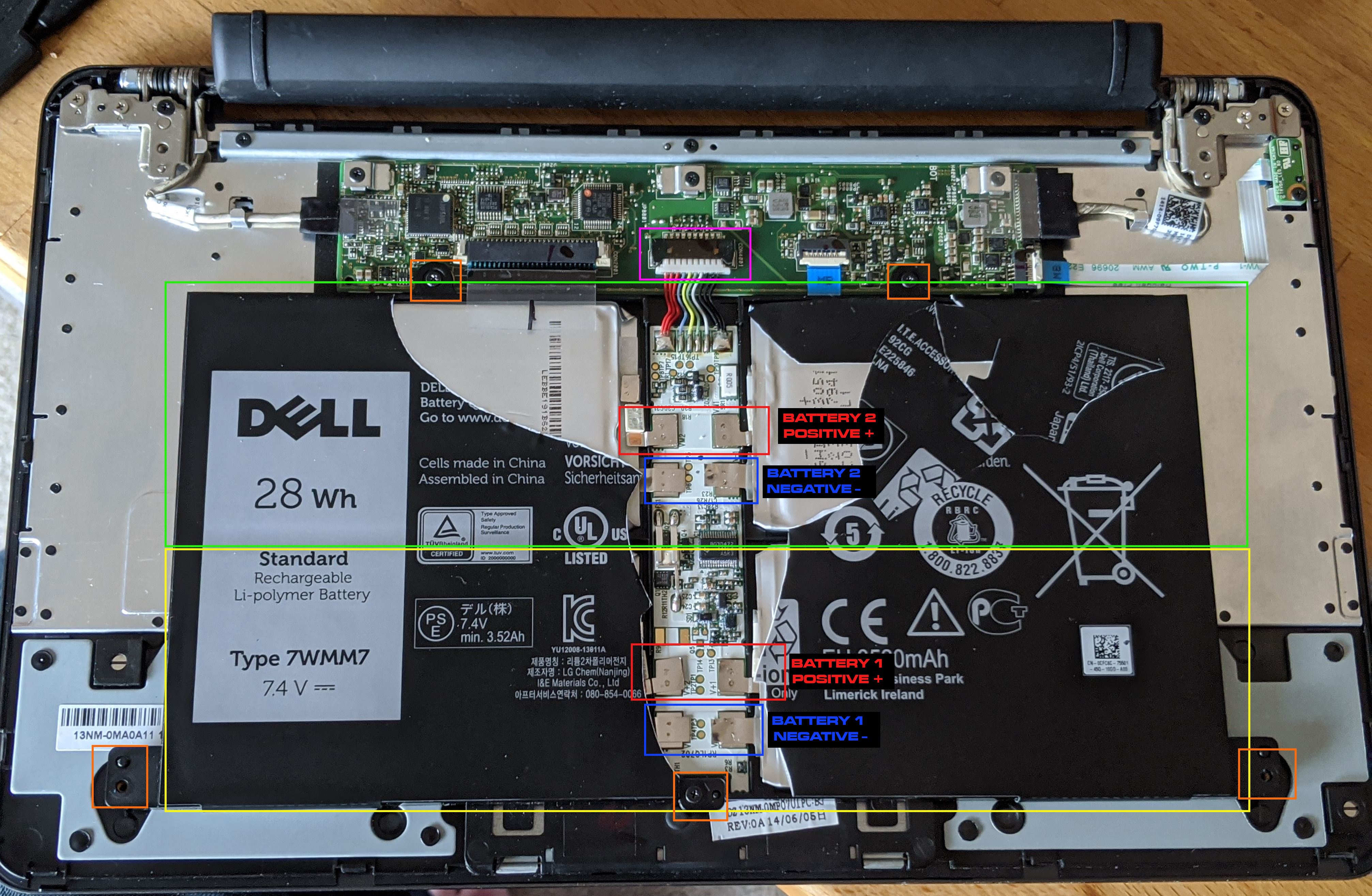 Inside the keyboard: the 7.4V battery with the two cell pairs boxed in yellow and green, the battery connector in pink, the screws in orange, and the positive and negative pads for each pair labelled